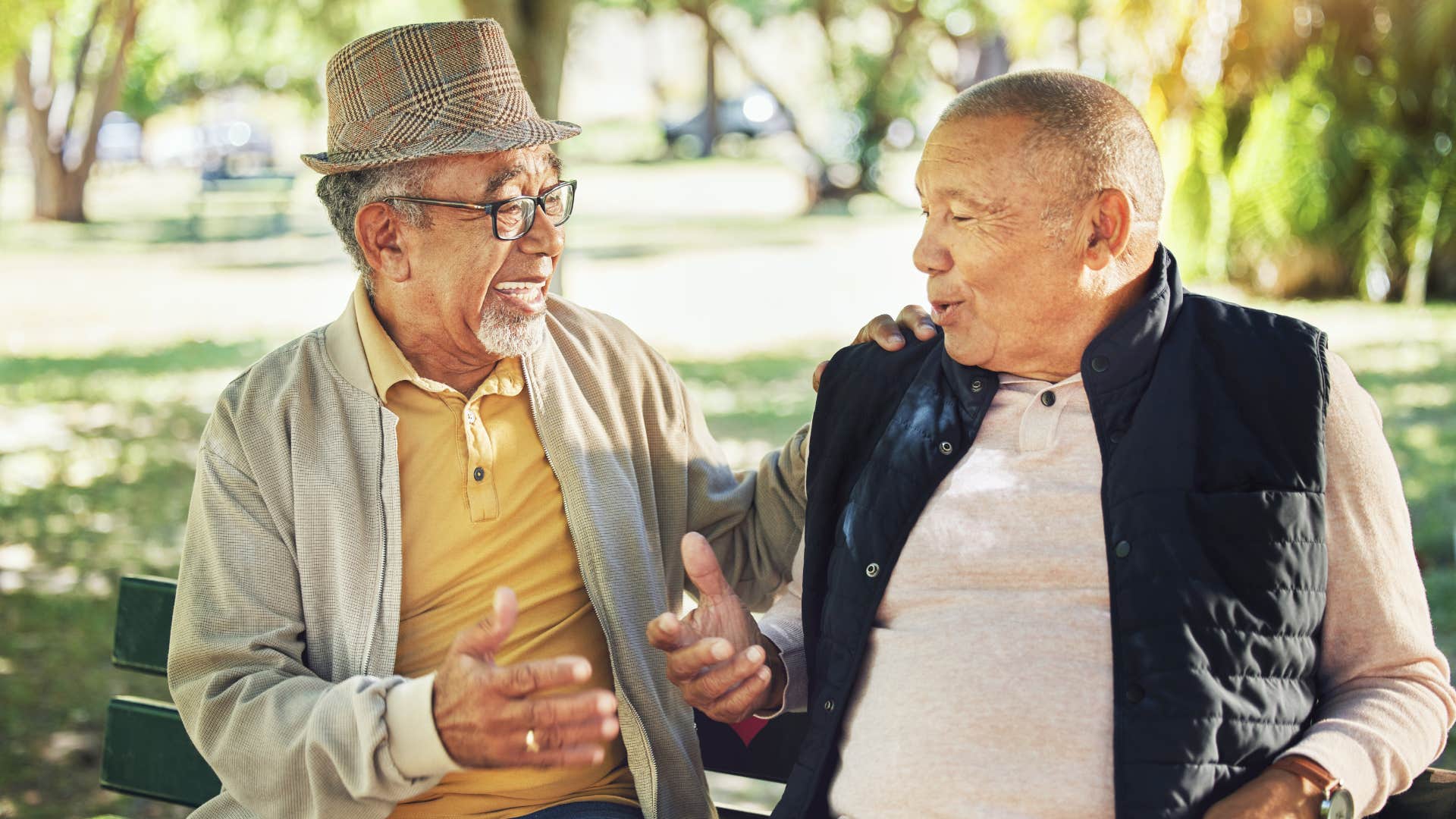 older man asking questions to his friend in conversation