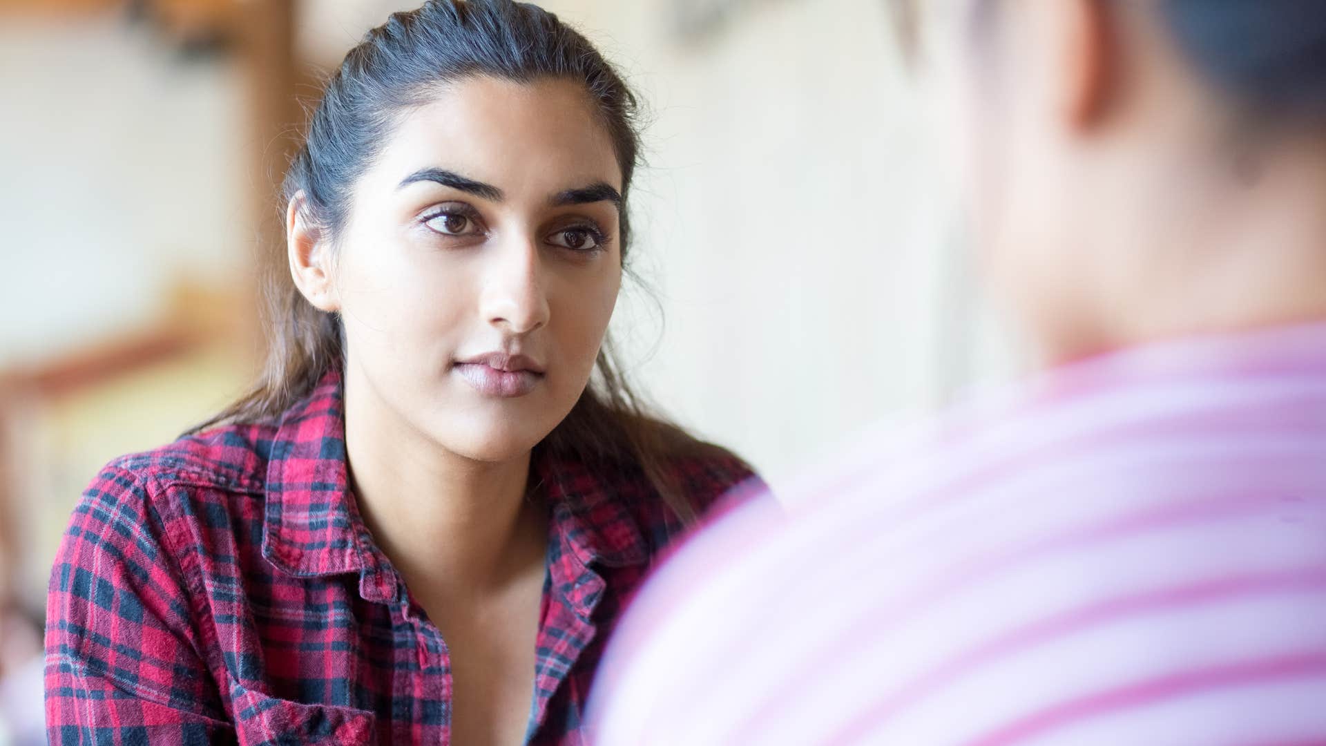 woman in tense conversation not buckling under pressure