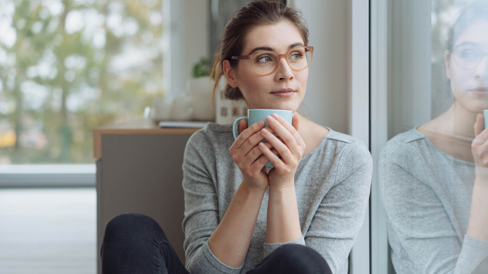woman who thinks ahead observing the world outside