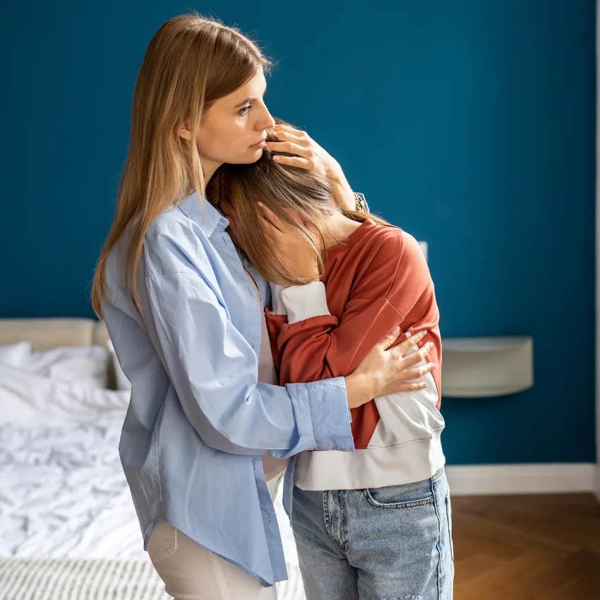 mom comforting her teen daughter