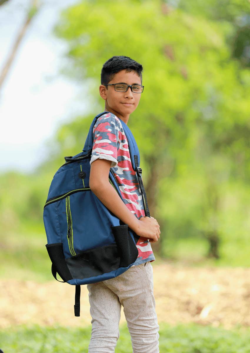 teenage boy walking to school alone