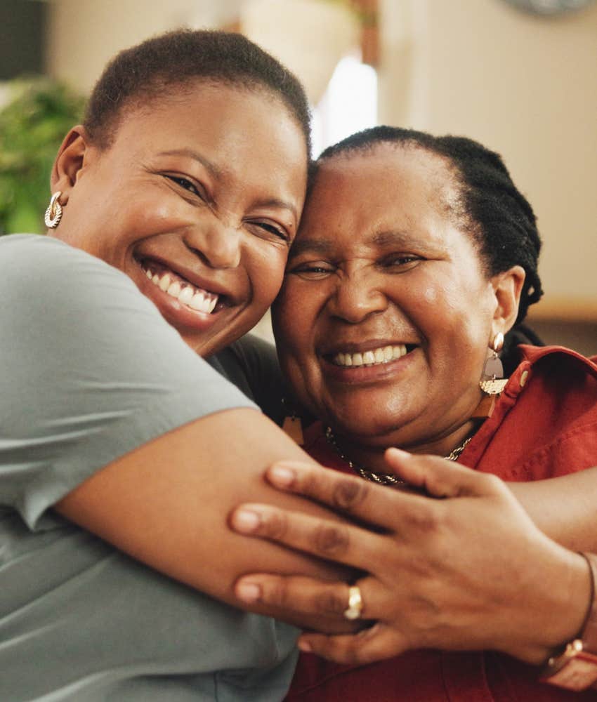 happy people hug and laugh showing emotional intelligence