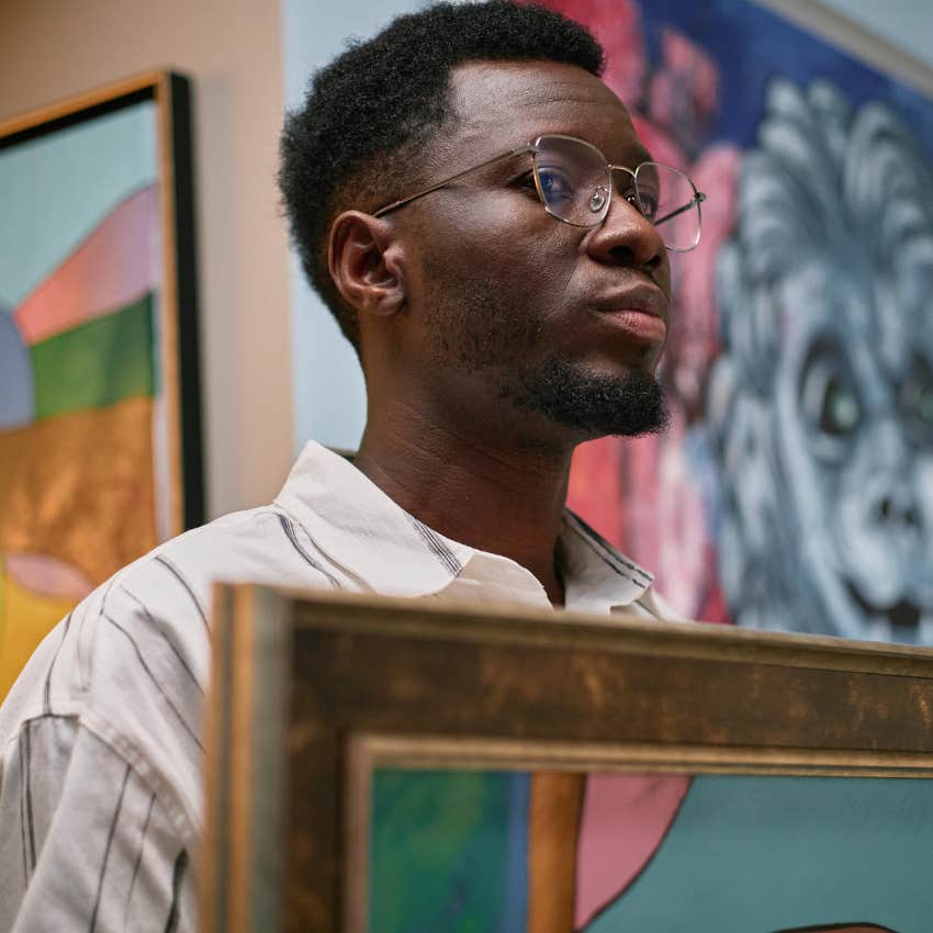 intelligent man at a museum appreciating art on a deeper level