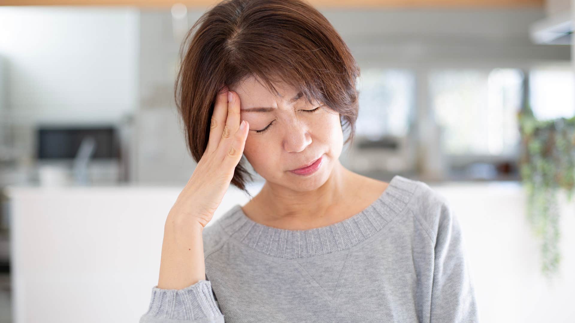 Woman keeping her mental health under wraps at home.