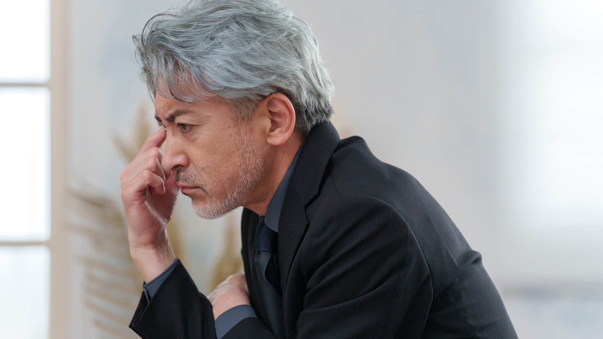 Man who's never changing his mind thinking at home.