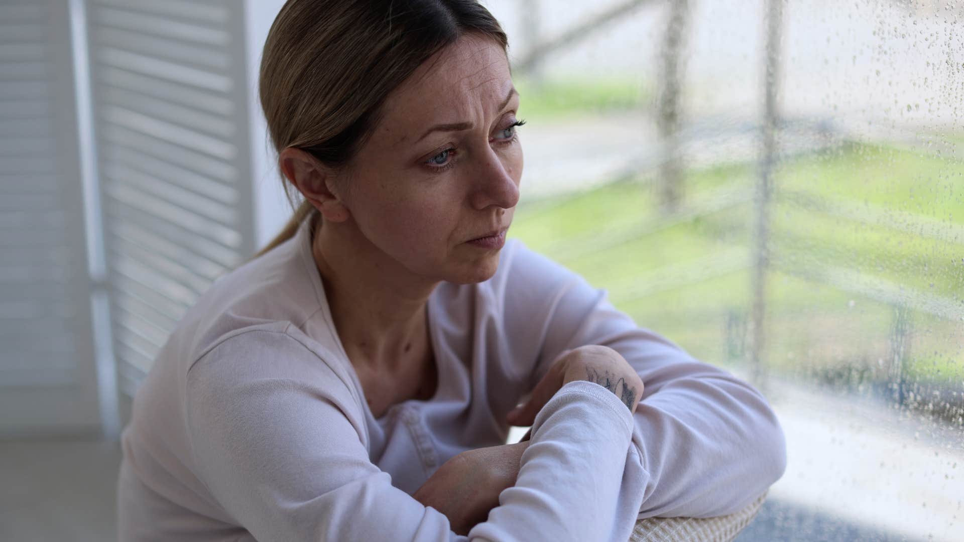 Woman thinking about surviving in life at home.