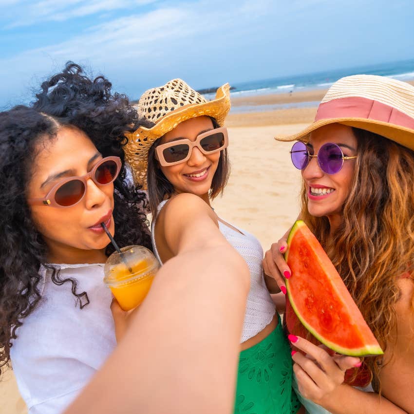 group of friends taking a photo of vacation