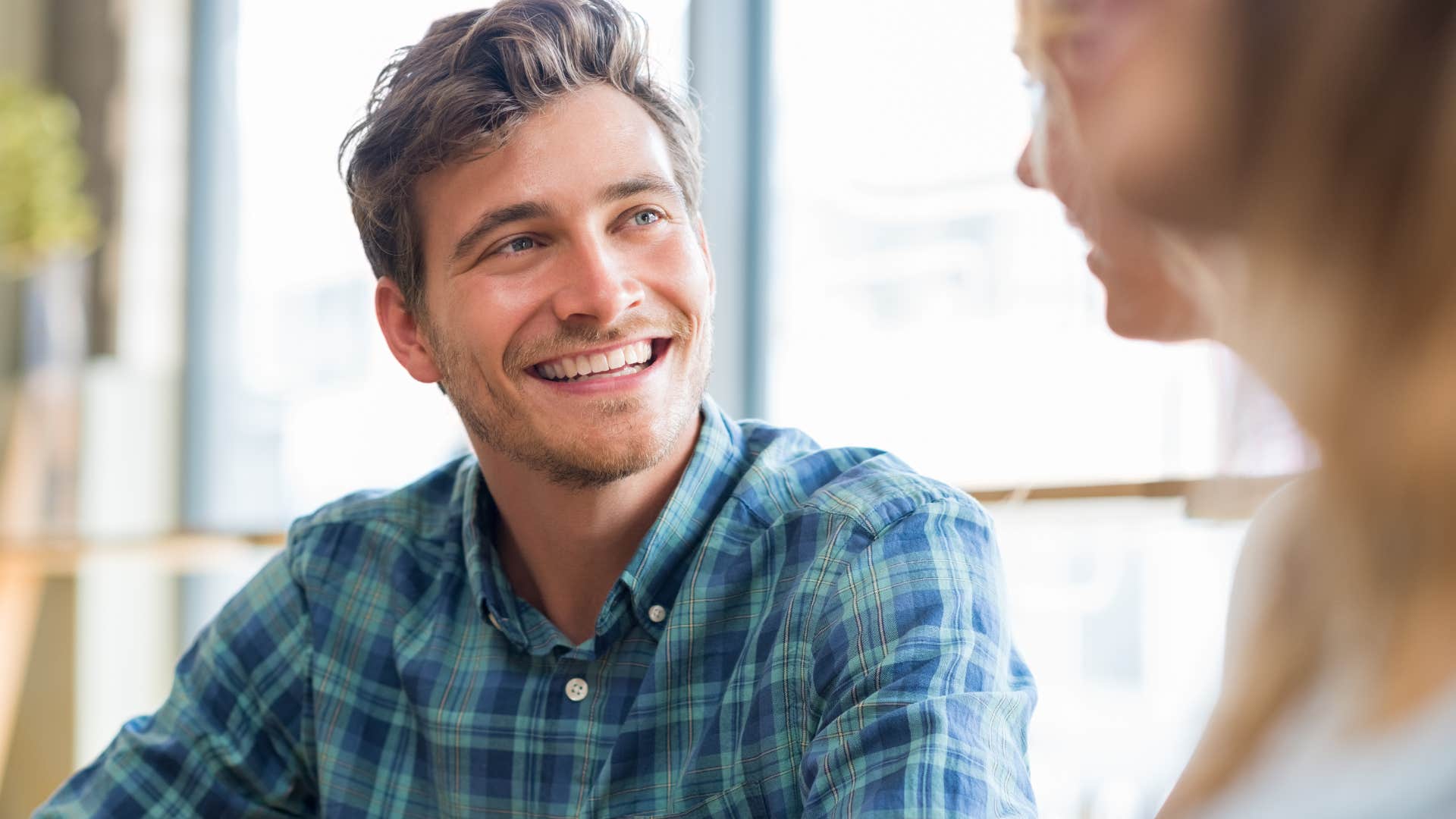 man actively listening to woman speak