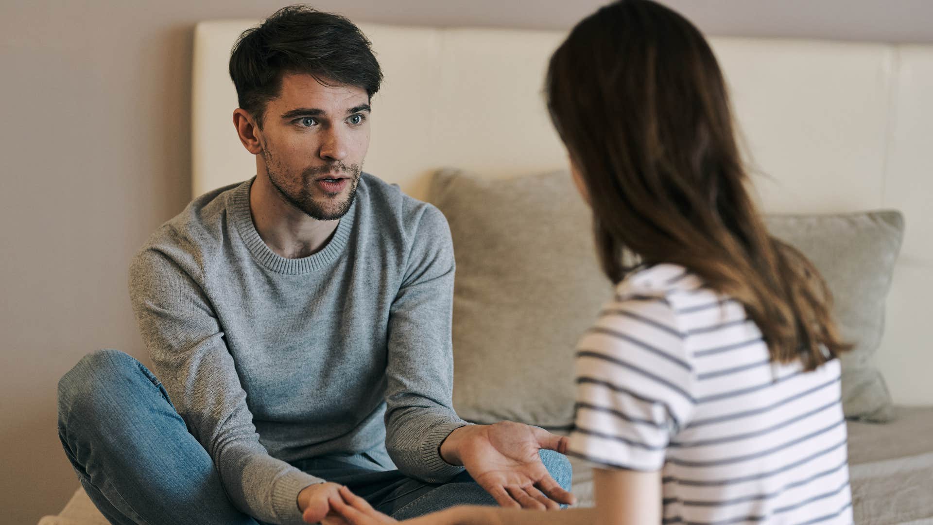 man holding his partner's hands following through with promises