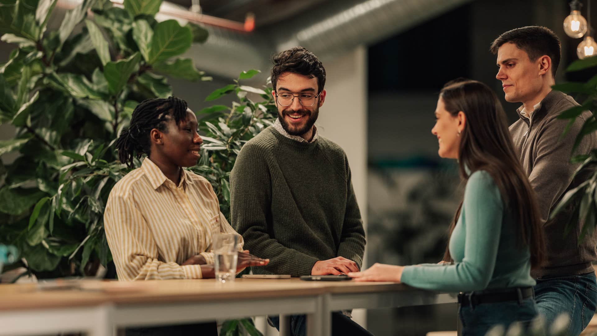 group of employees gossiping at work