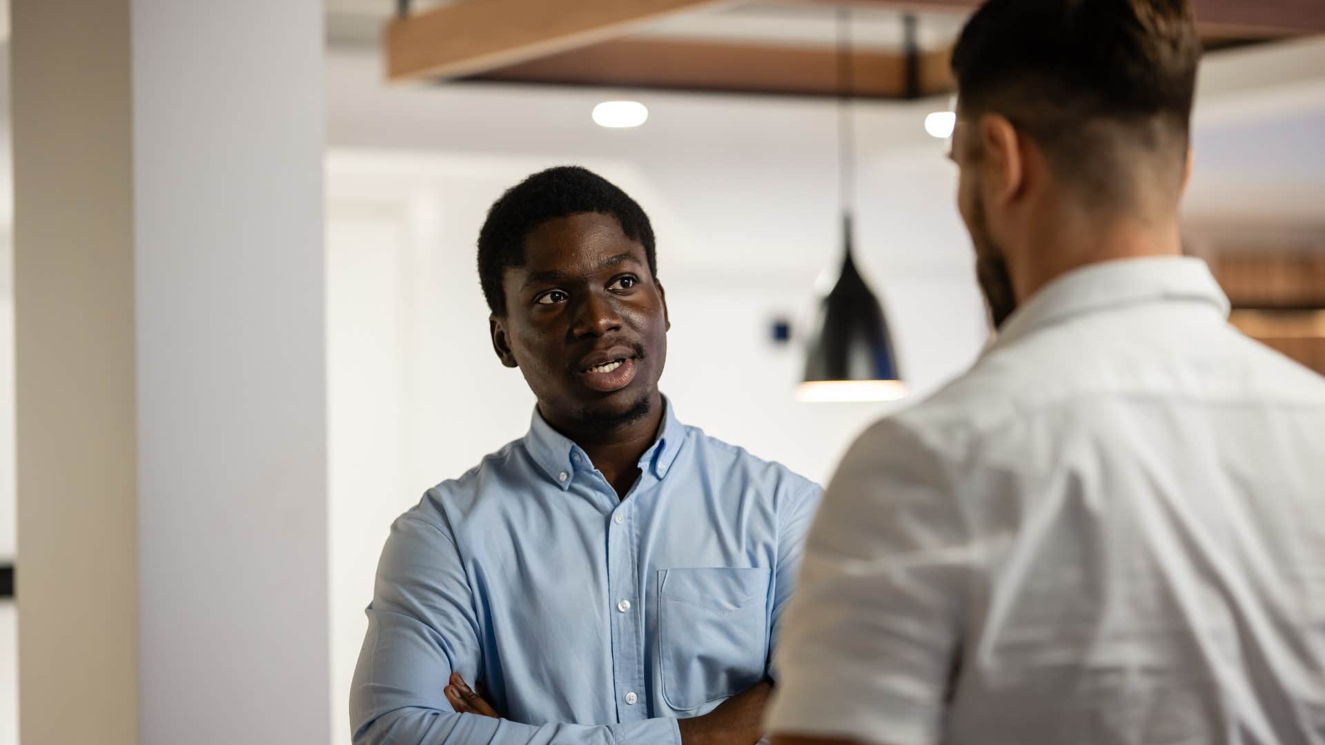 boss and employee engaged in a serious workplace discussion