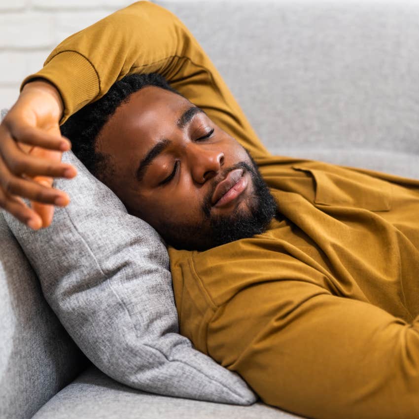 Man taking breaks and naps at home on his couch.