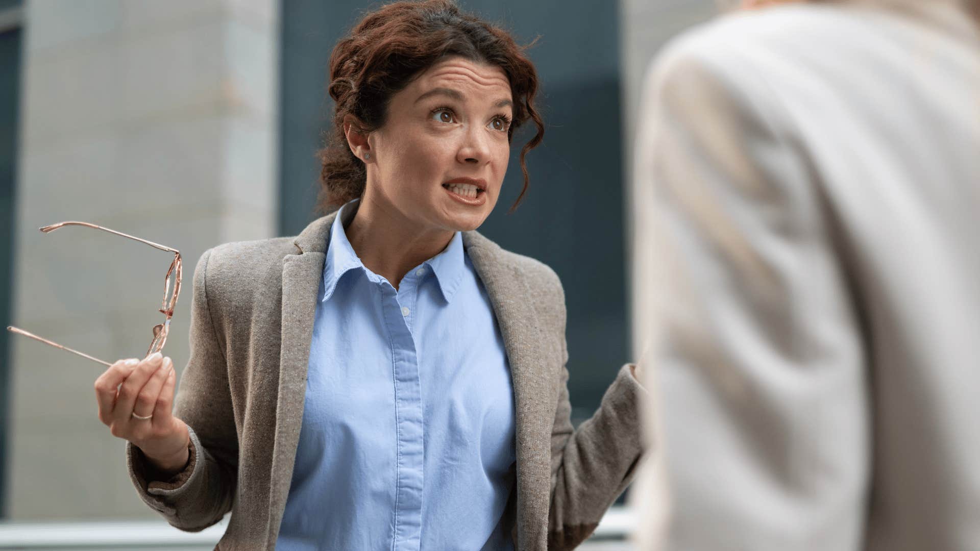 Woman arguing for no reason with a co-worker.