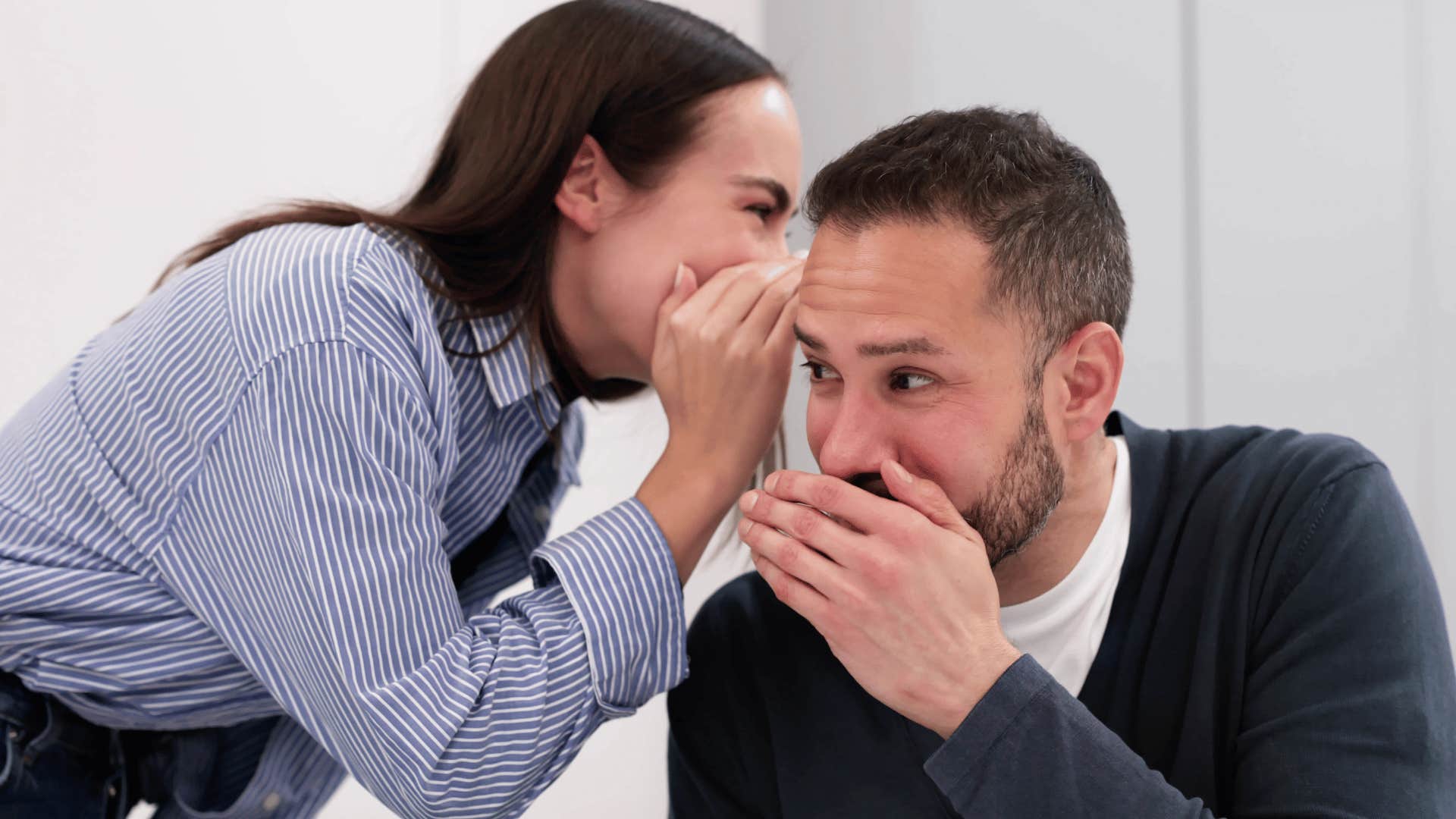 Co-workers talking down on other people in an office.