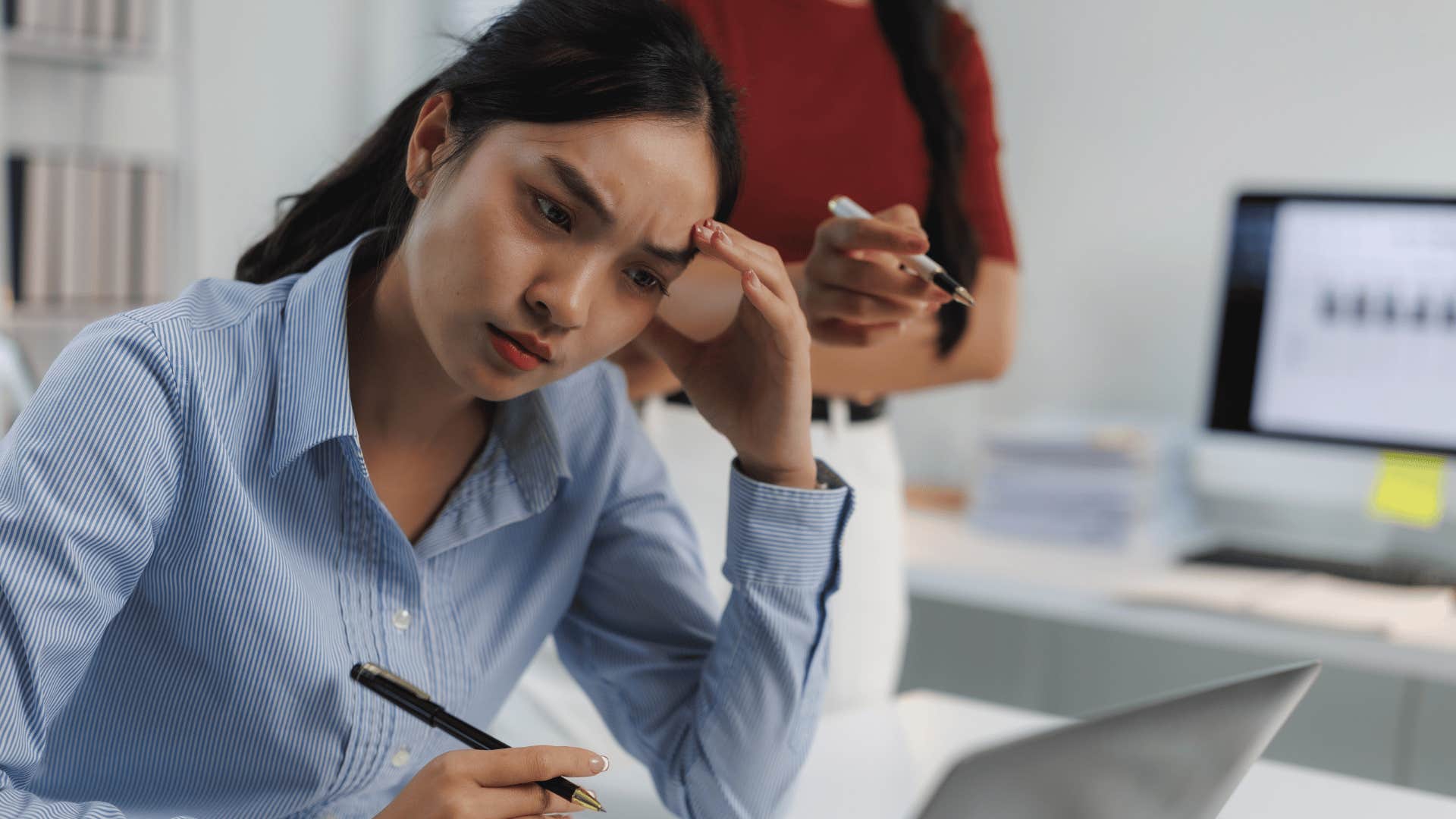 Woman trying to hide her mistakes at work. 