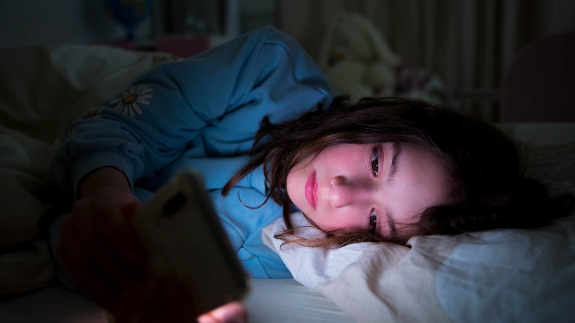 woman doomscrolling when she should be sleeping