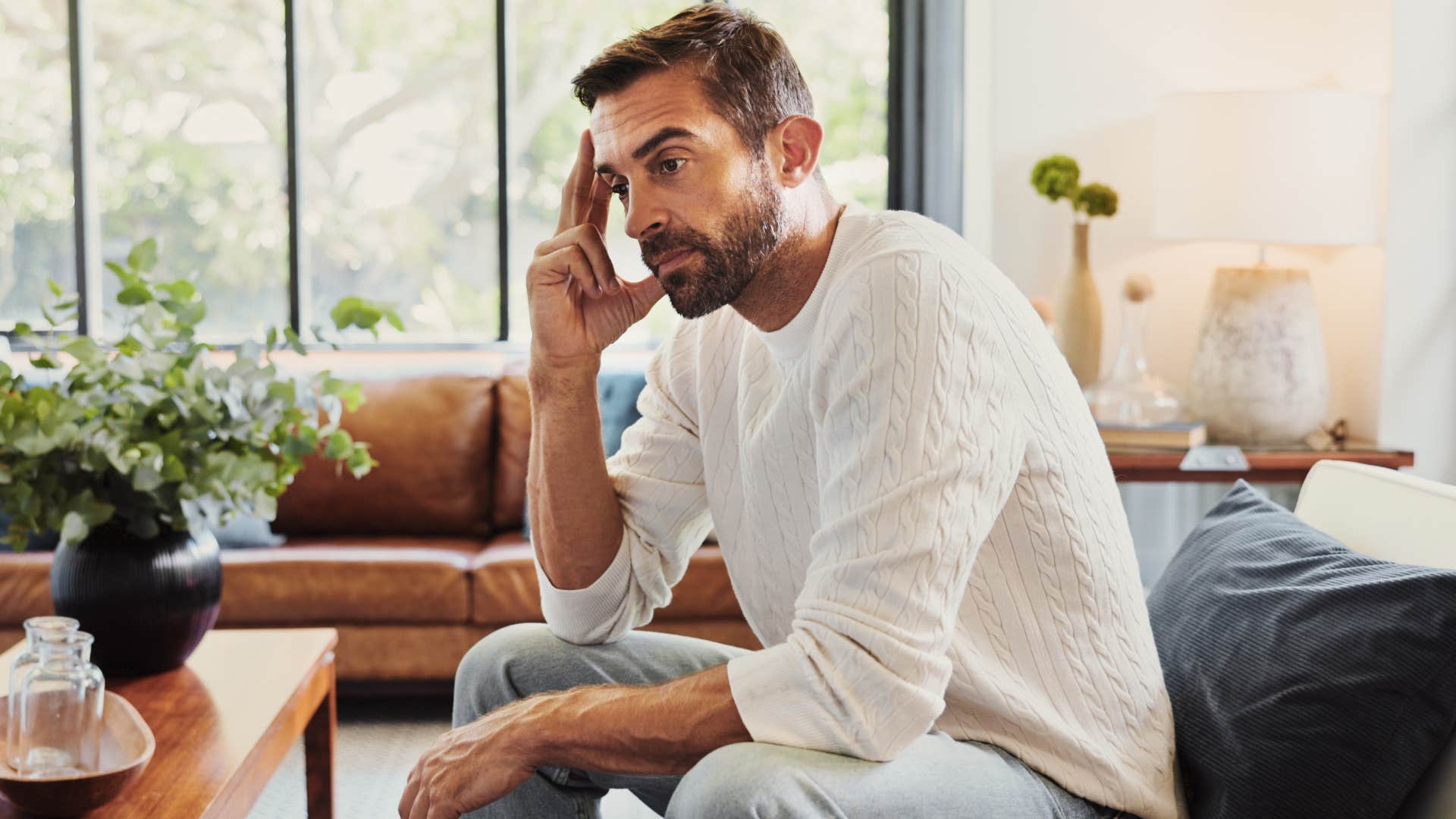 man fearing failure more than anything sitting alone at home
