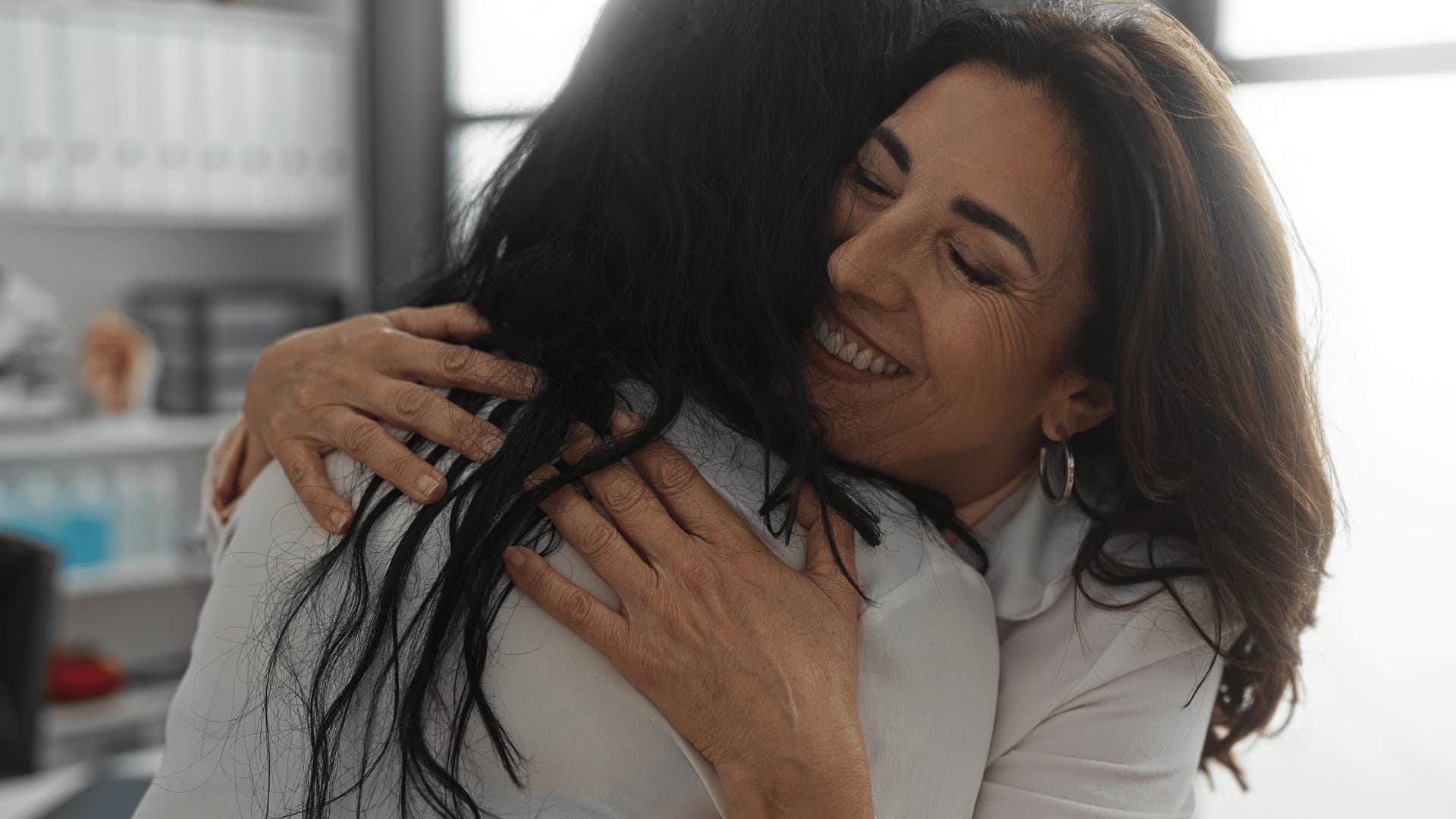 woman hugging her mom who is reliable and consistent