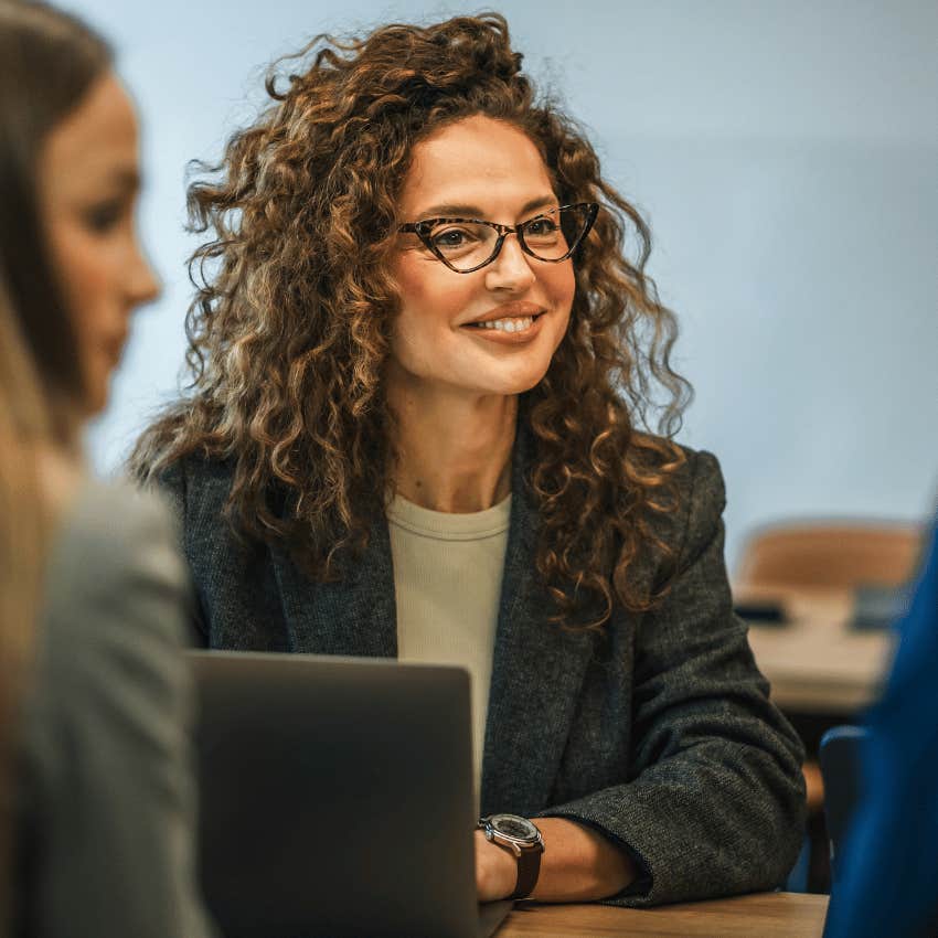 gen x woman smiling at work going with the flow