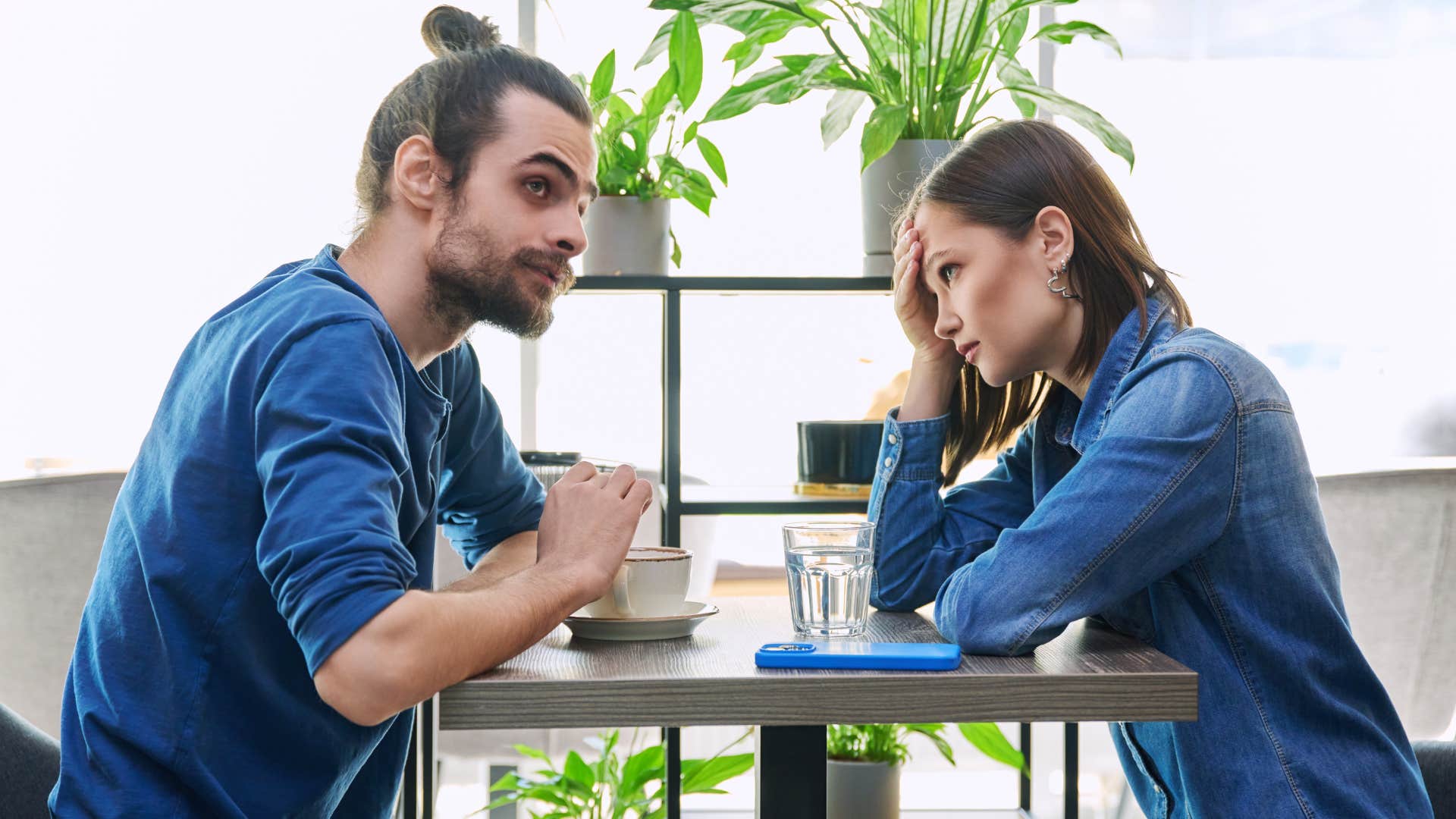 couple talking as classy woman refuses to engage in argument