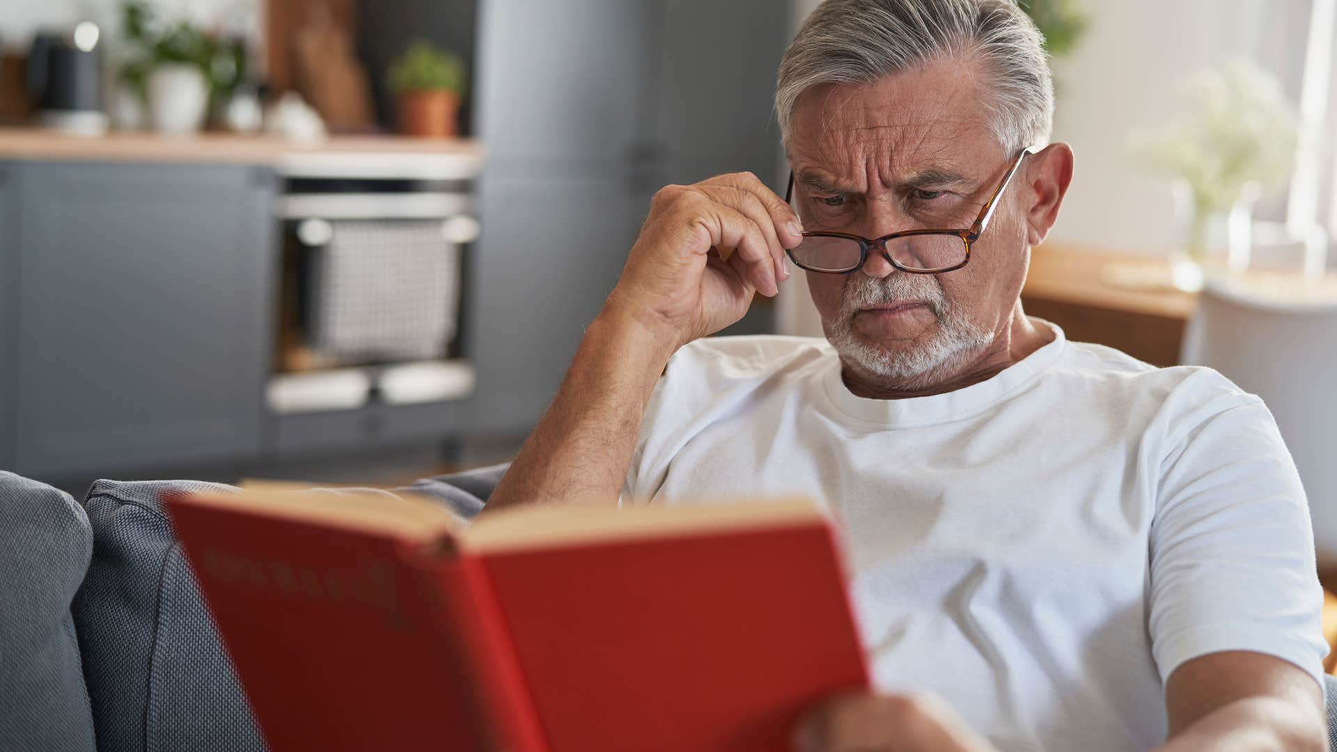 smart man reading a book diving deep into obscure topics