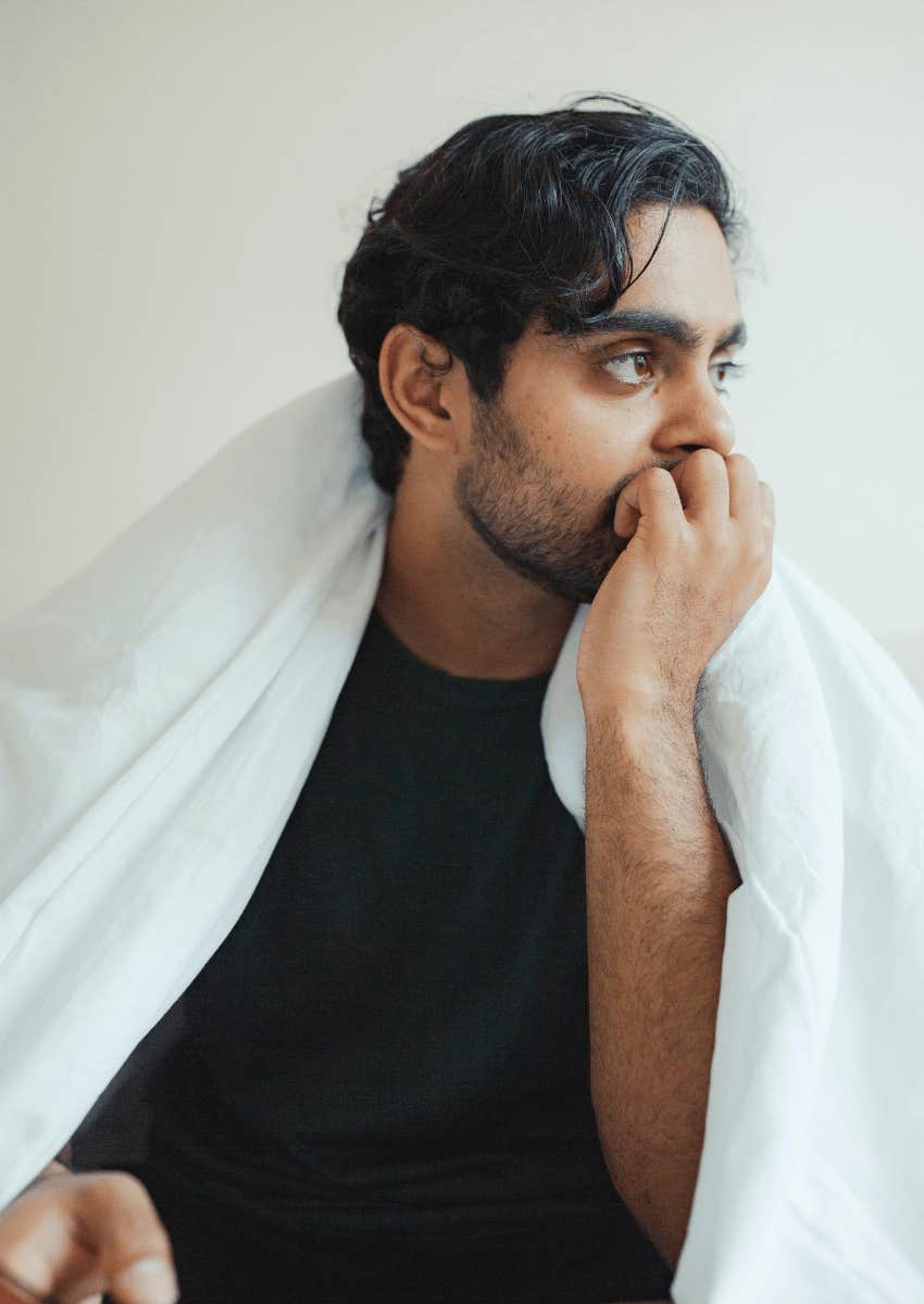thoughtful young man thinking about his previous relationships