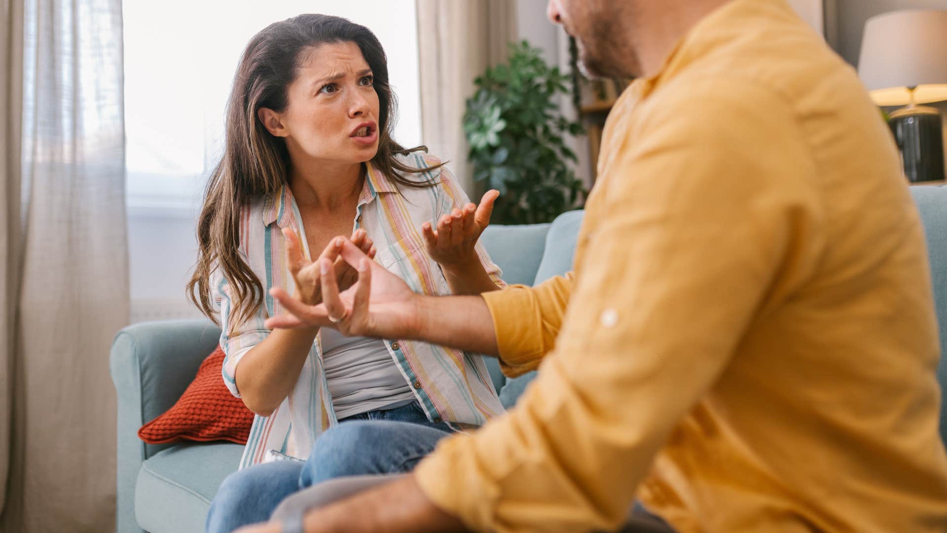 man asking ignorant questions to his angry wife