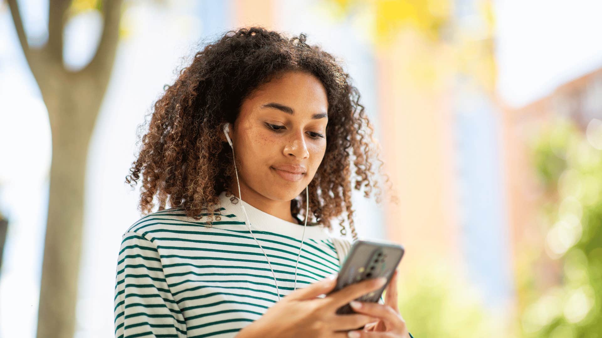 woman texting her parents that she's keeping things private right now