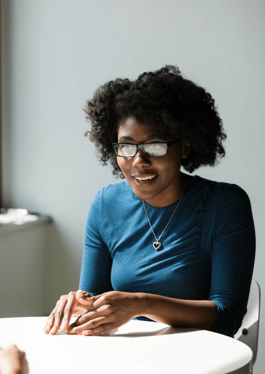 woman of color speaking and gesturing with her hands