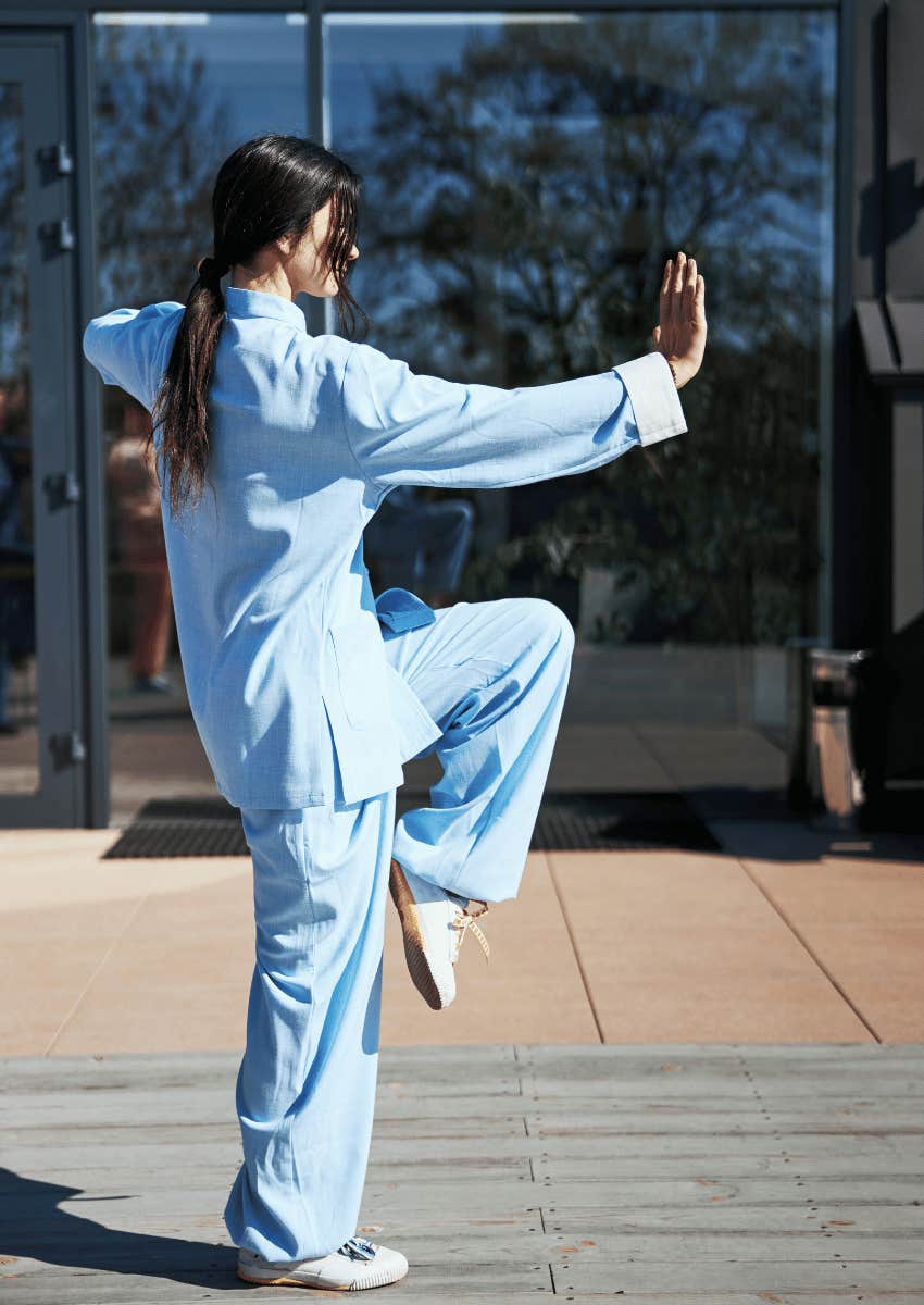 woman doing tai chi outdoors