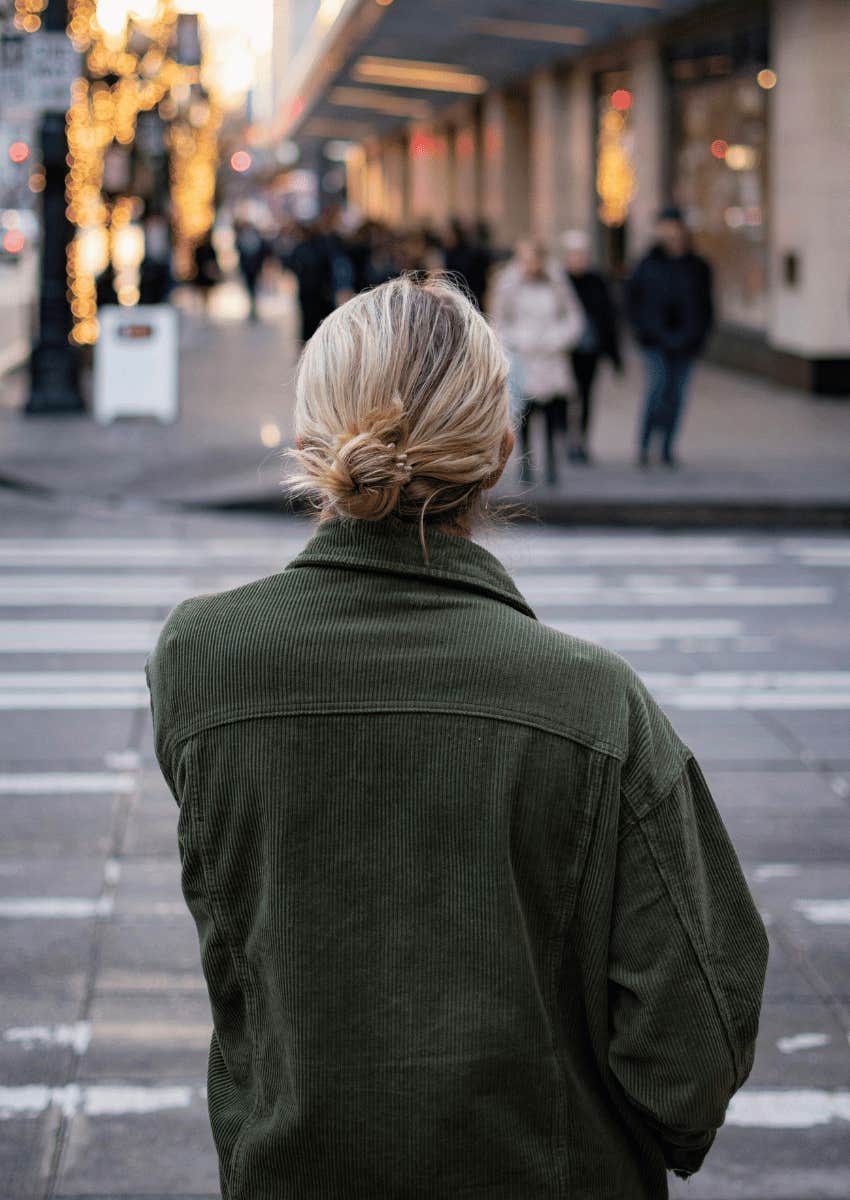 woman walking down public street people watching