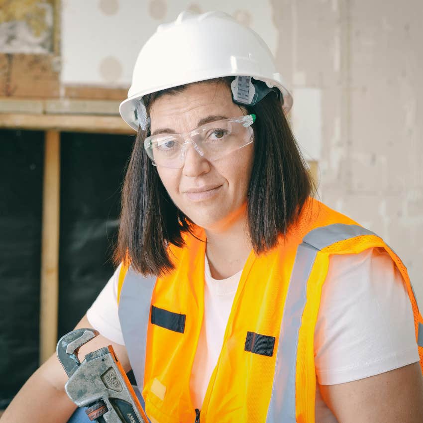 tradeswoman working with tools
