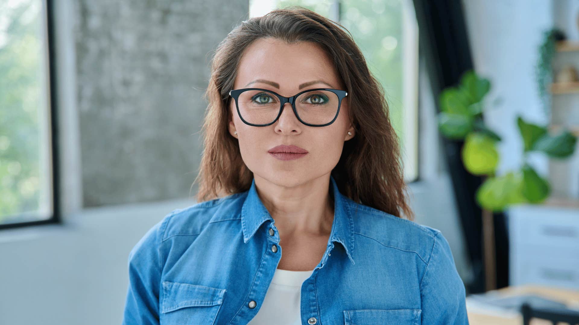 very serious woman staring straight ahead