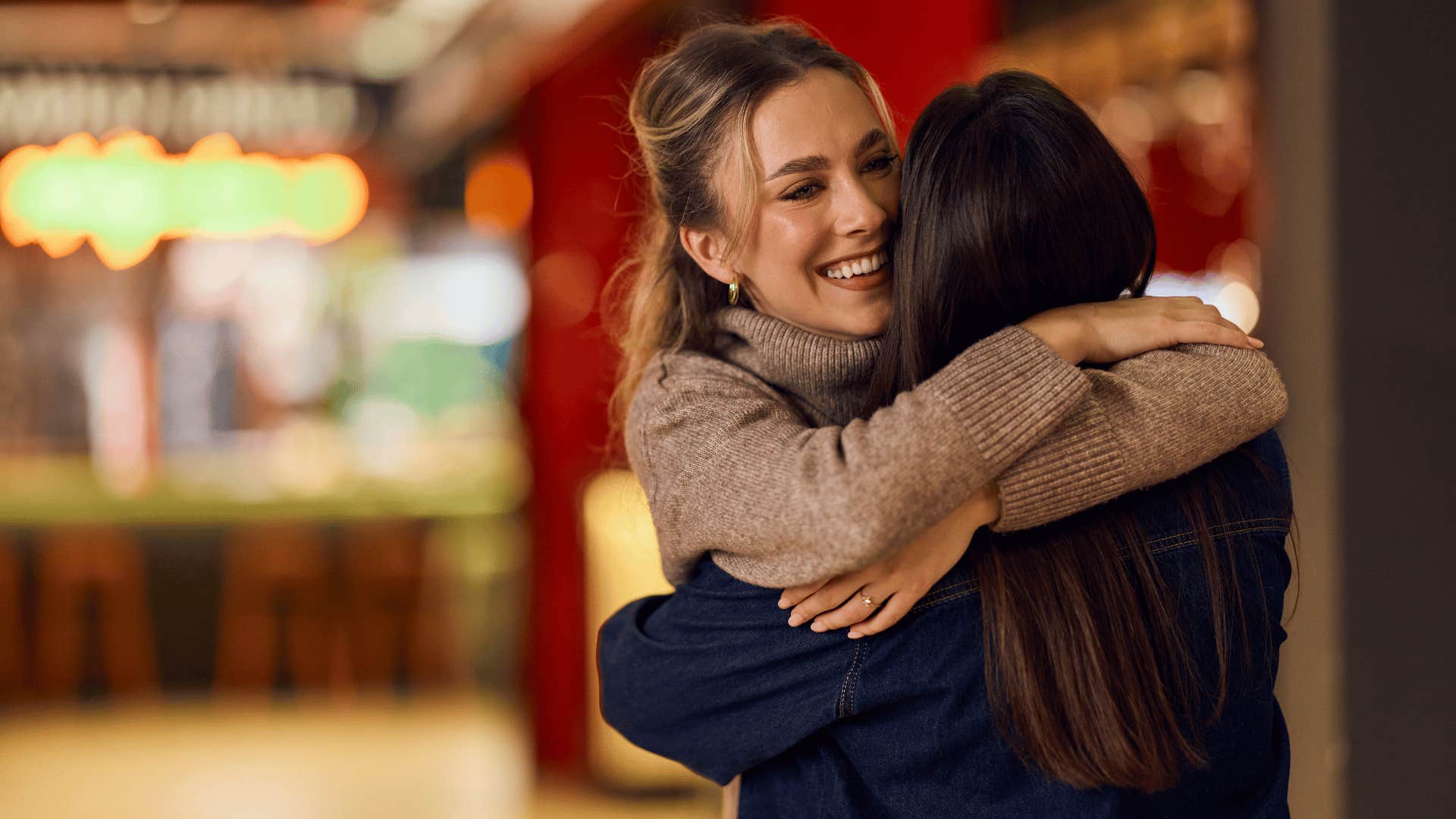 high-class woman going out of her way to make someone feel welcomed and included