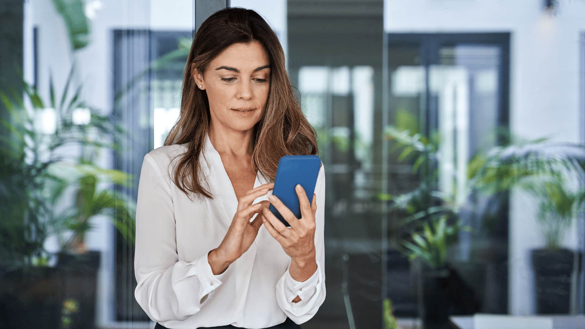 woman who looks high class practicing proper phone etiquette
