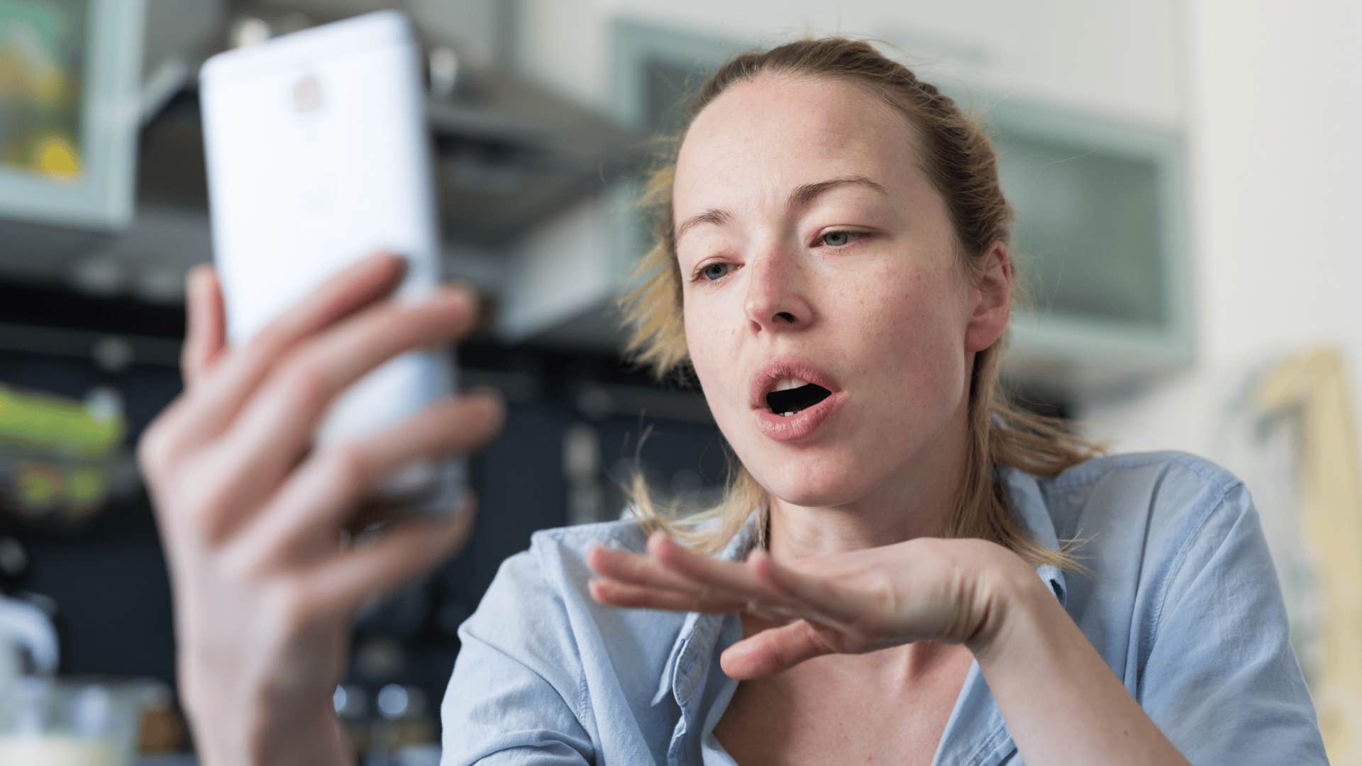 woman speaking calmly and clearly on the phone