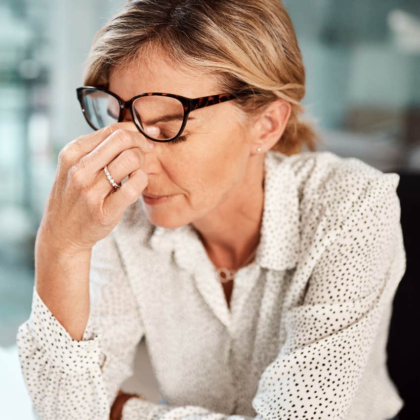 hyper-independent woman looking stressed at work
