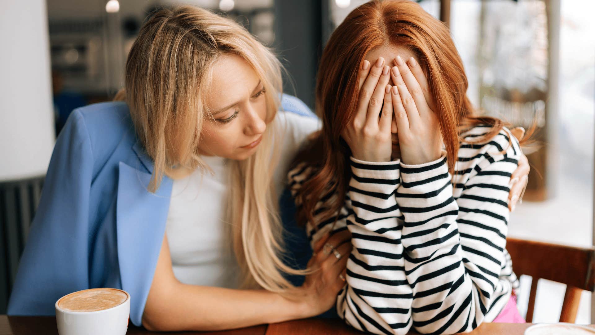 Woman saying I don't know why I'm crying to her friend