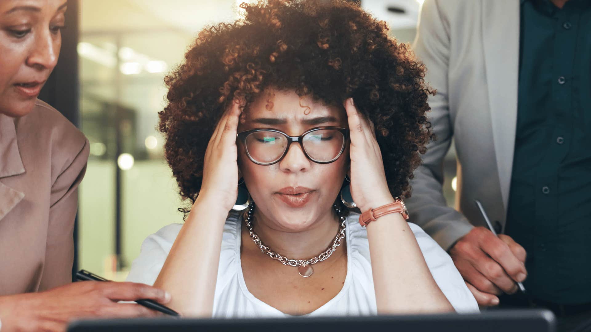 Woman saying she has so much to do at work looking stressed