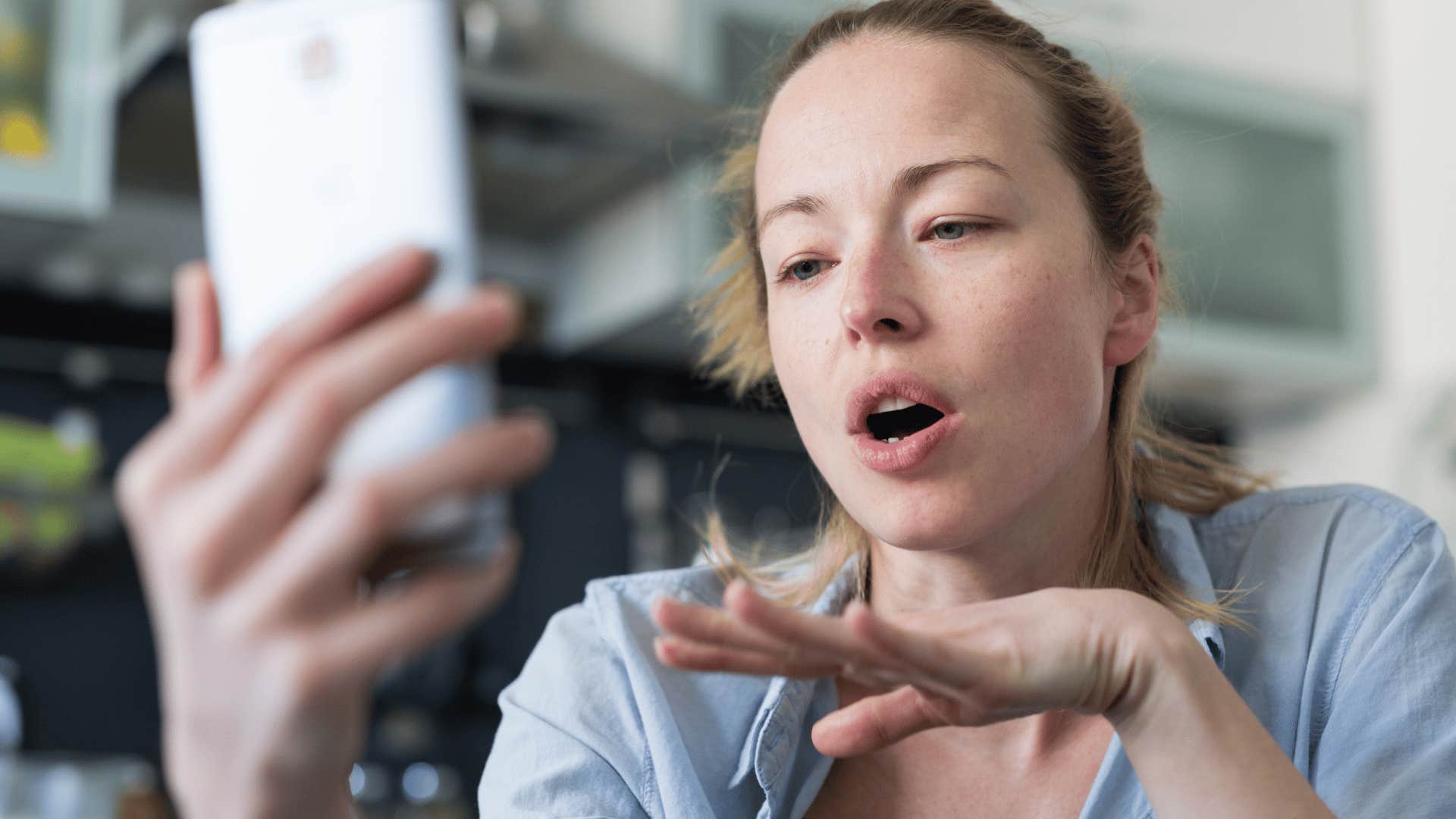 Woman saying she's a bad texter while talking on the phone