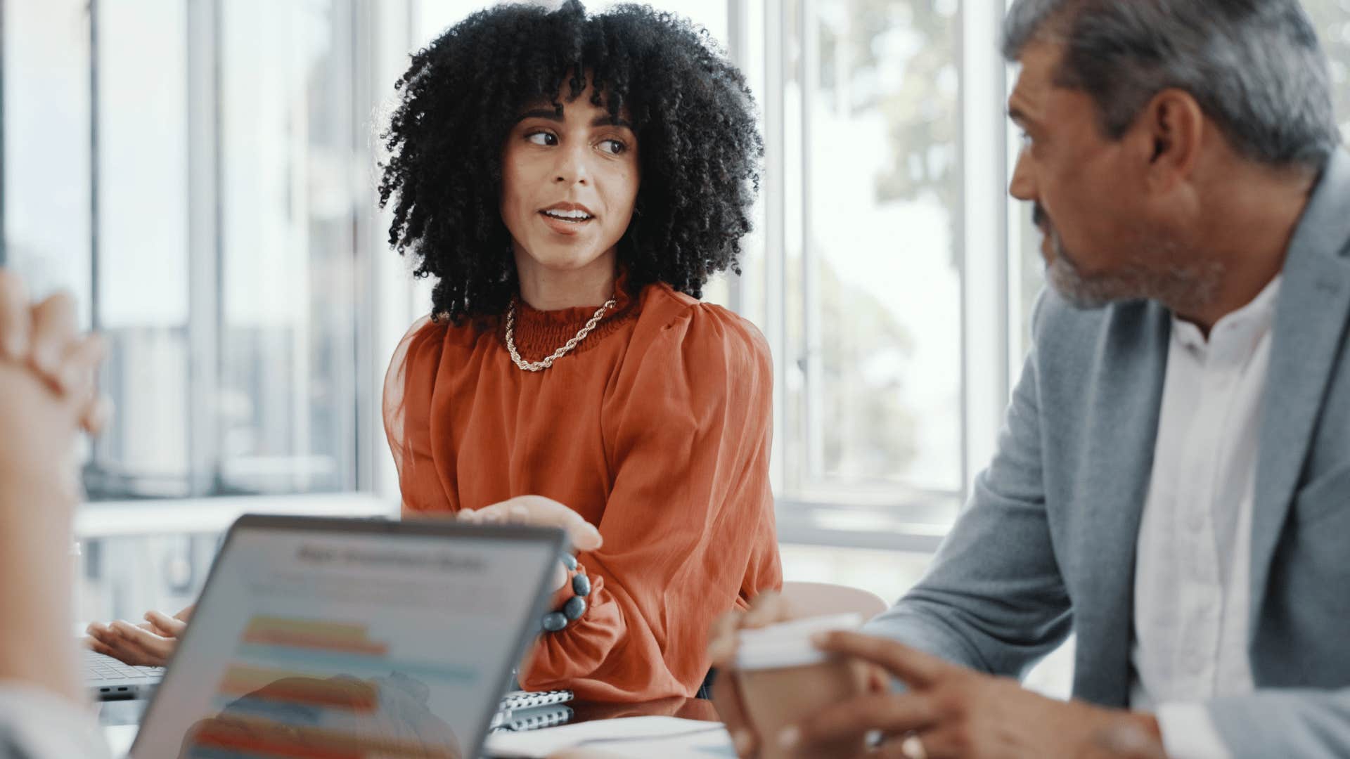 Woman asking someone what they were just saying at work