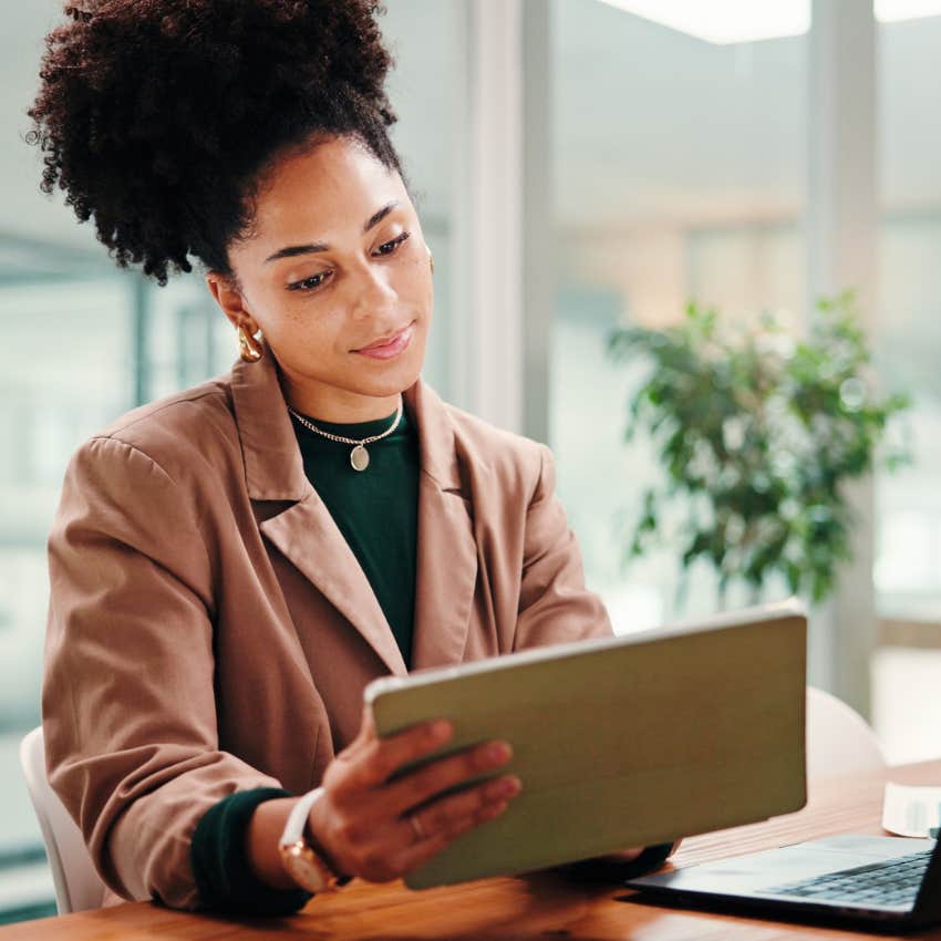 woman working on tablet in office
