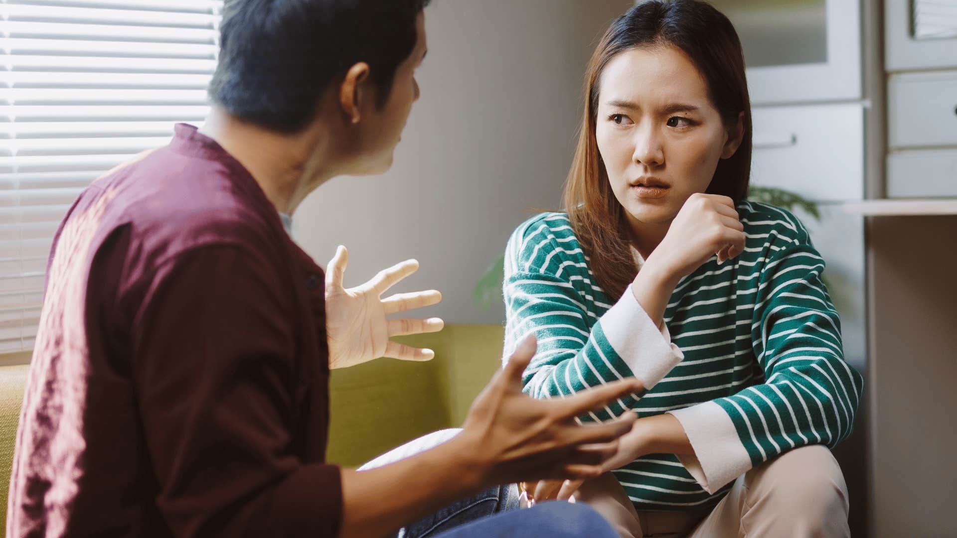 needy woman asking are you mad at me to her upset partner