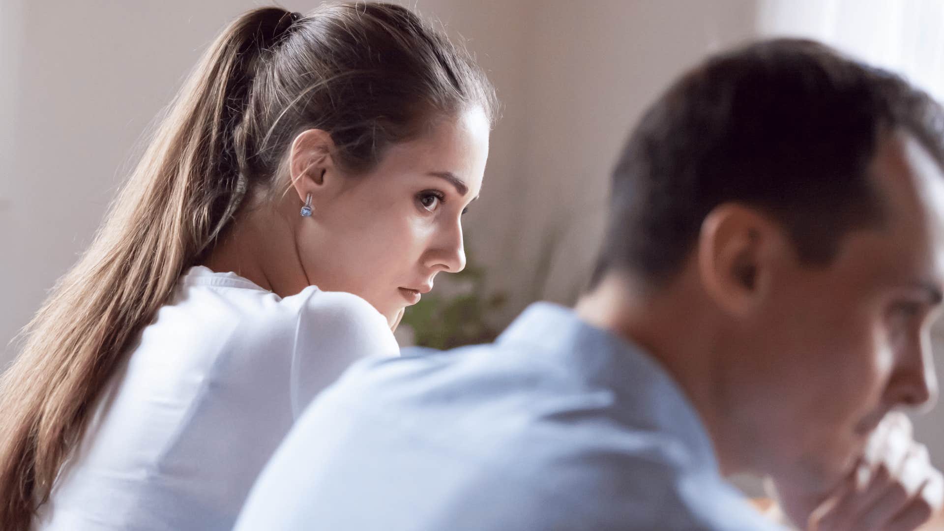 needy woman turned away from partner telling him I'll just leave you alone