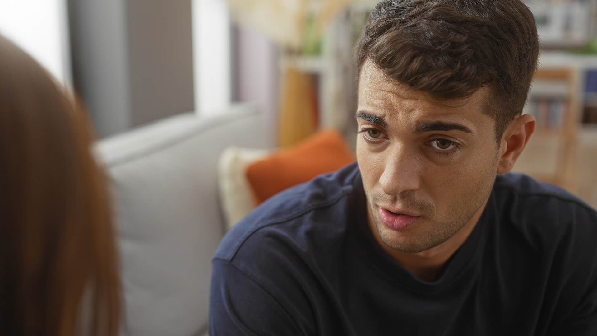 sad man having conversation with friend telling them I don't want to be a burden