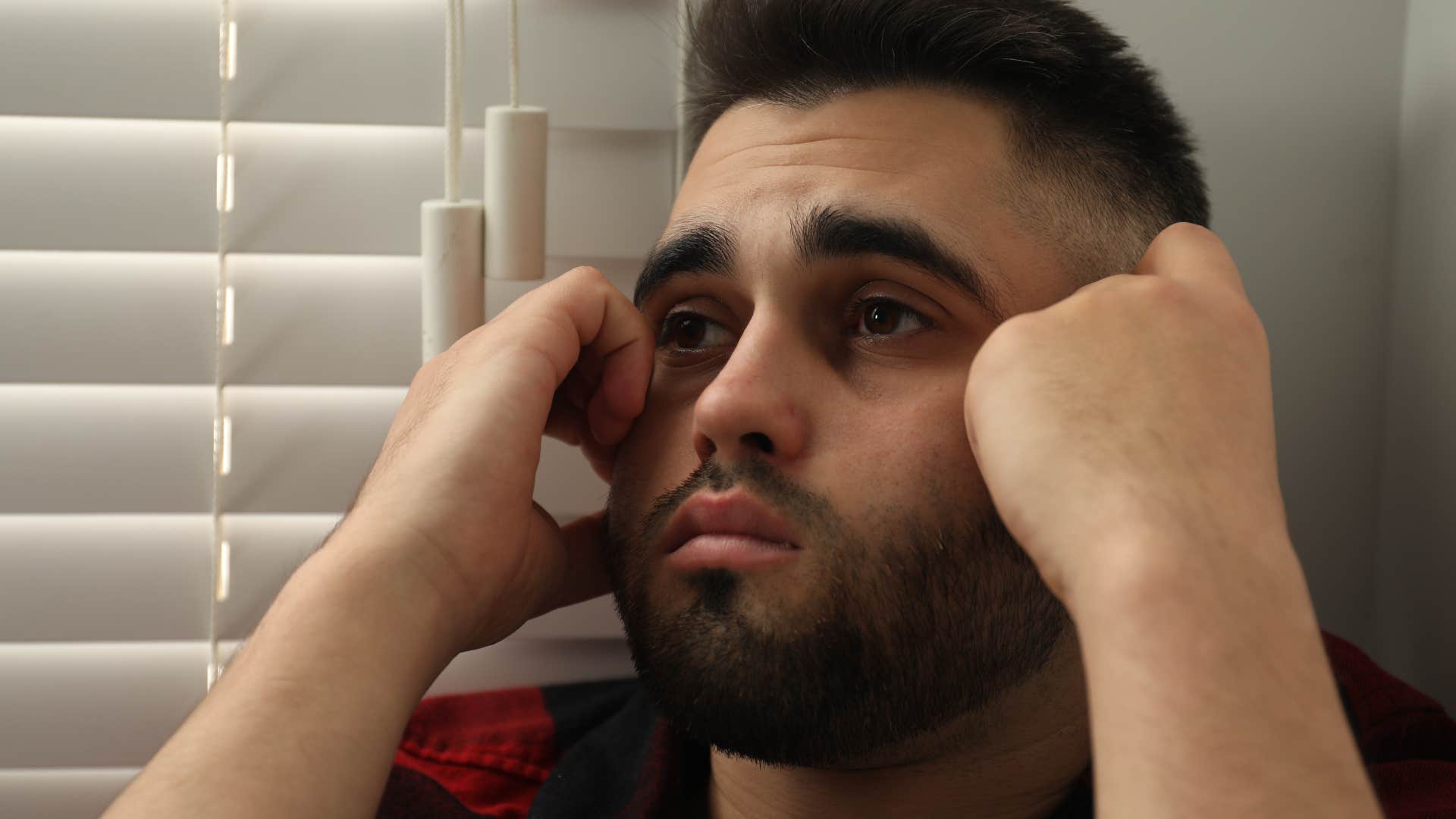 man feeling extremely sad saying it's all my fault