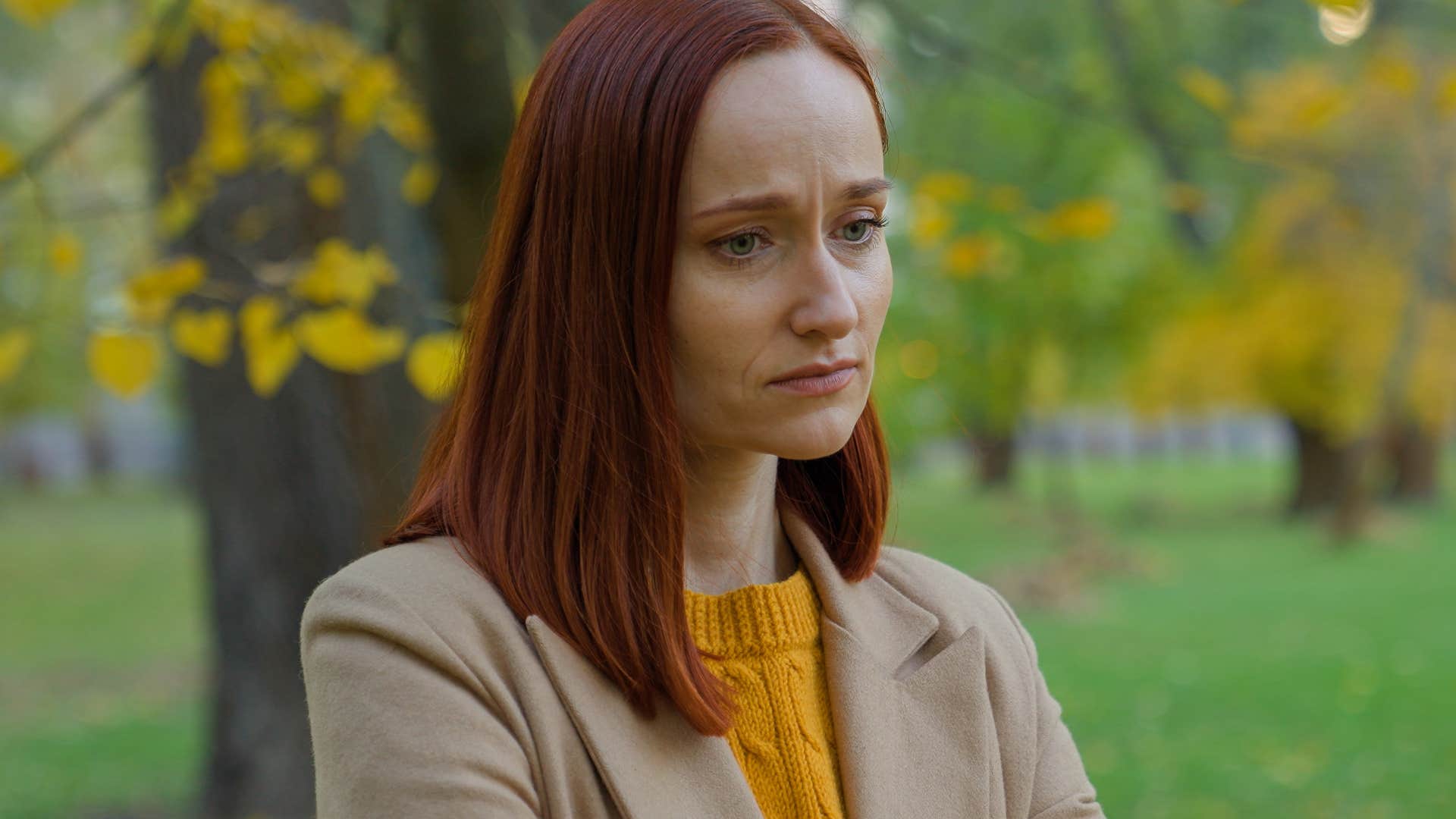sad woman standing outside saying none of that matters anyway