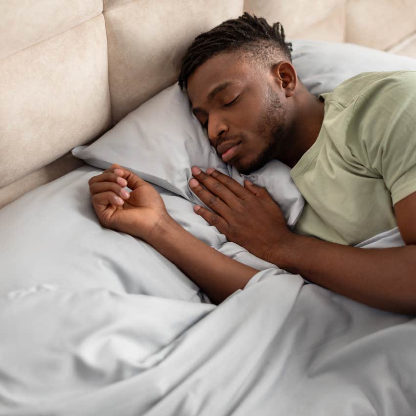 man sleeping in bed