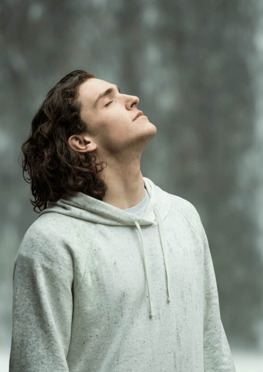 young man breathing fresh air