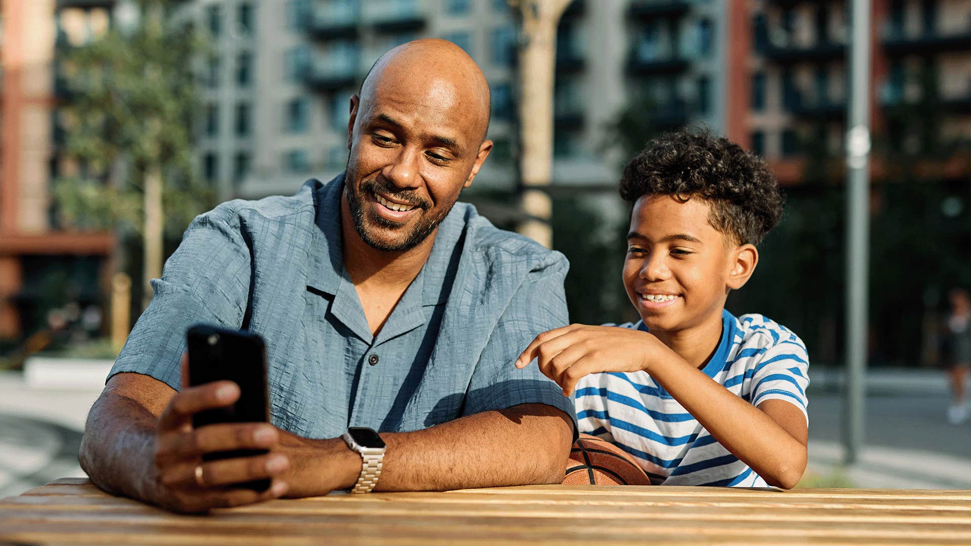 dad teaching child that tipping etiquette is part of treating people with respect